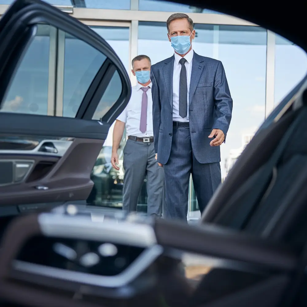 Executive Tours chauffeur opening a car door for a client