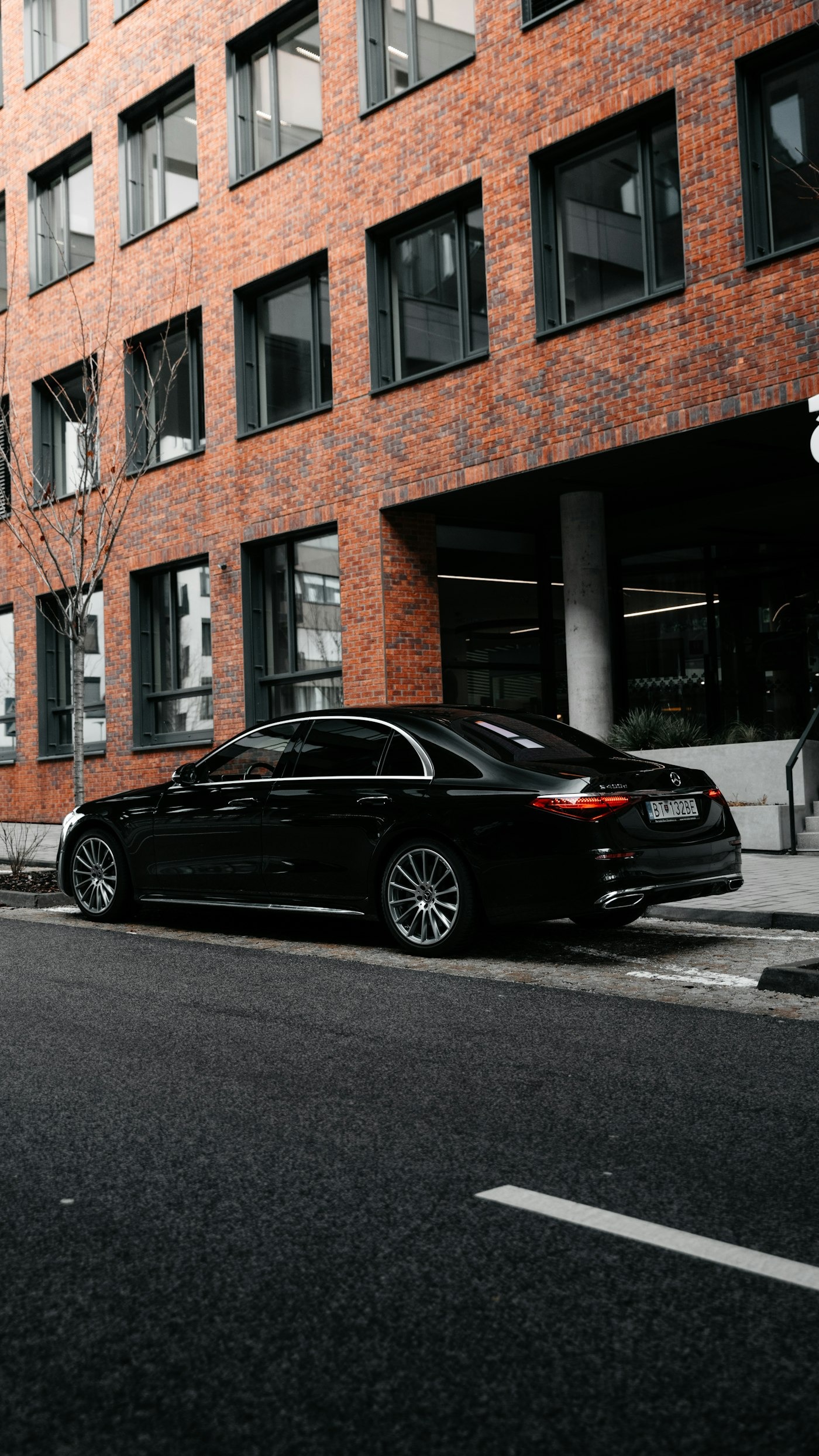 Executive Tours chauffeur opening a car door for a client